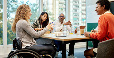 Diverse group of people sitting at meeting table