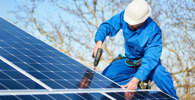 man installing solar panels