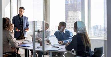 people meeting in an office having a discussion